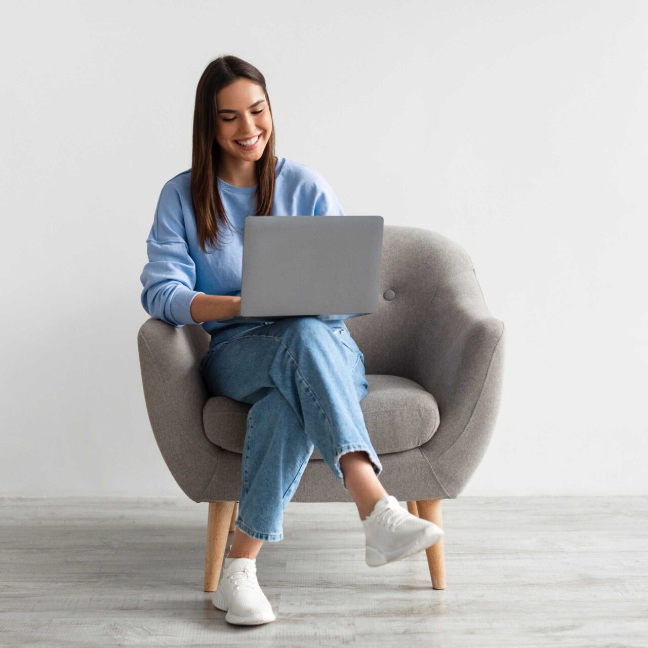 Woman In Chair With Laptop