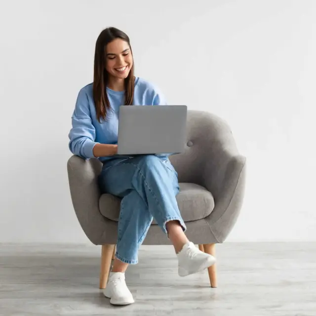 Woman in chair with laptop